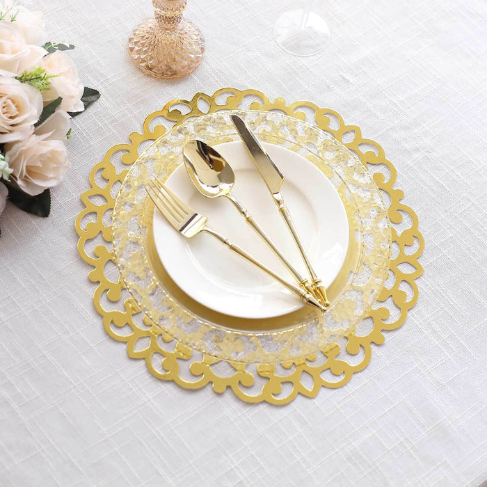Elegant gold charger plate with white dinnerware and cutlery on textured tablecloth.