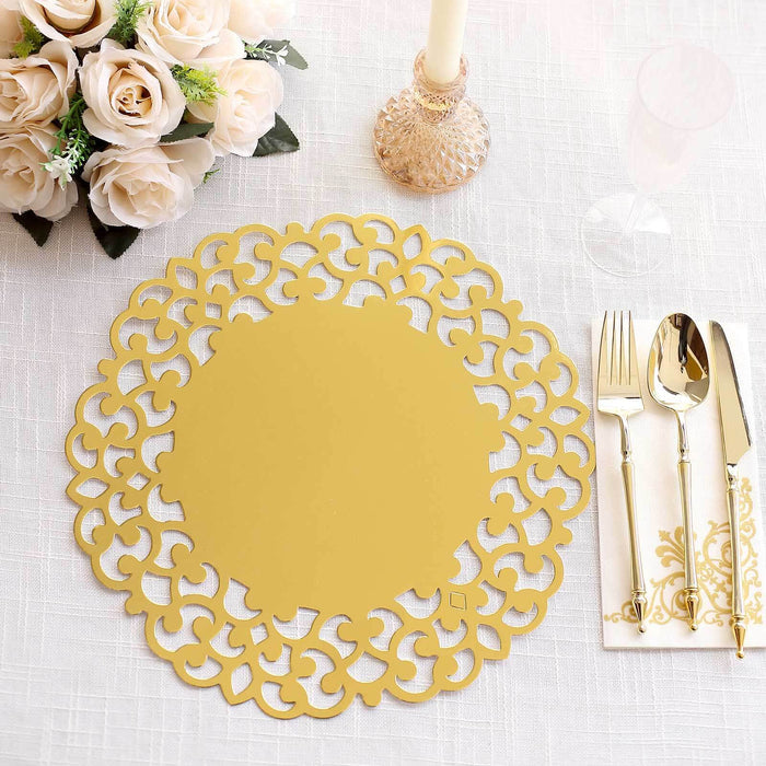 Gold decorative placemat on a dining table with flowers and cutlery.