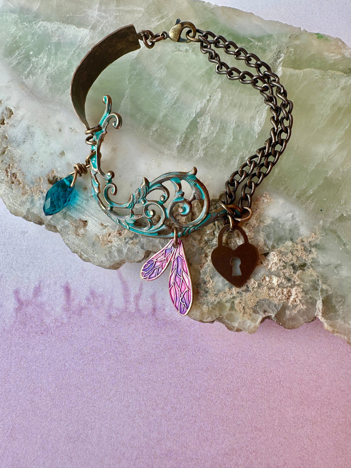 Vintage charm bracelet on stone