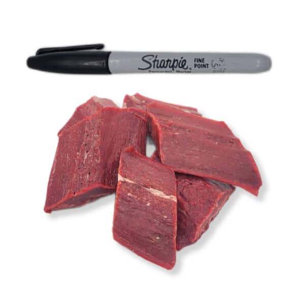 Back 2 Basics Pork Spleen Filet - 1lb Portion Pack, shown as thin, raw meat slabs beneath a black Sharpie marker for scale.