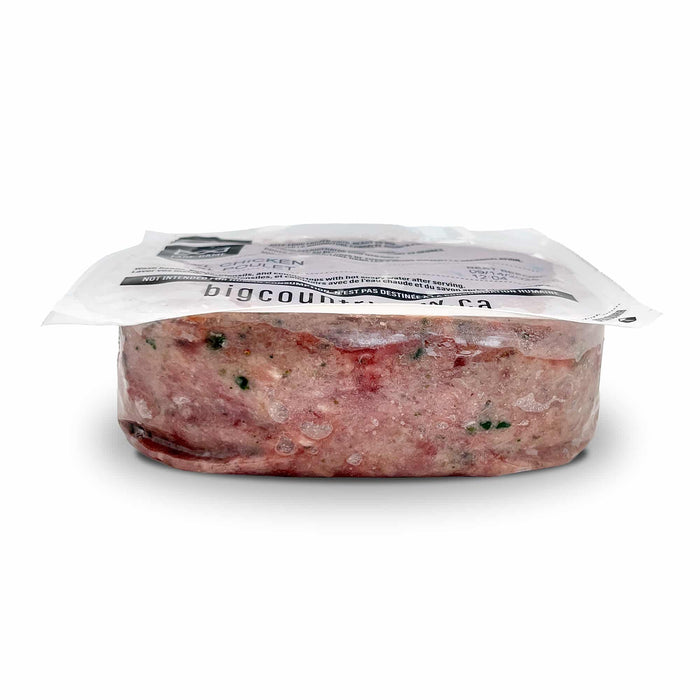 Big Country Raw XL Feast vacuum-sealed block, featuring coarsely ground, chicken-free proteins—Beef, Lamb, Turkey, Pork, Duck—blended with low-glycemic fruits and vegetables.
