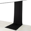 Black fabric backdrop draped elegantly on the floor