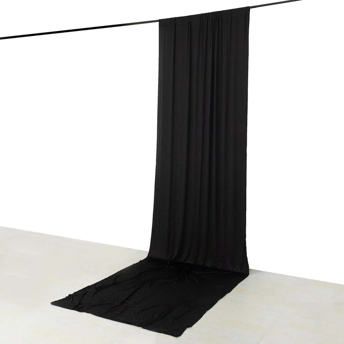 Black fabric backdrop draped elegantly on the floor