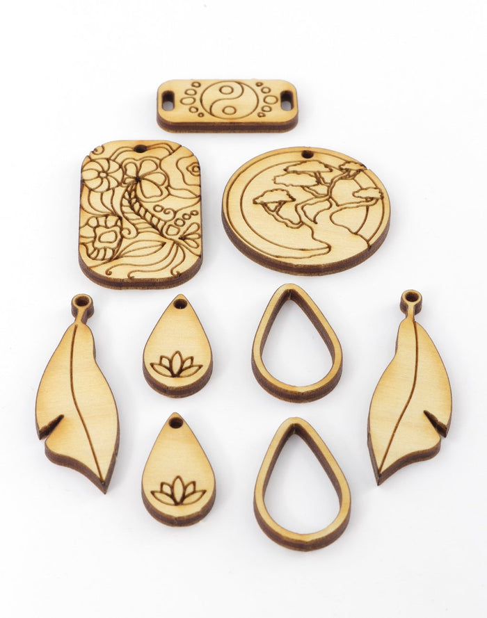 Wooden pendants with floral, earth, and yin-yang designs