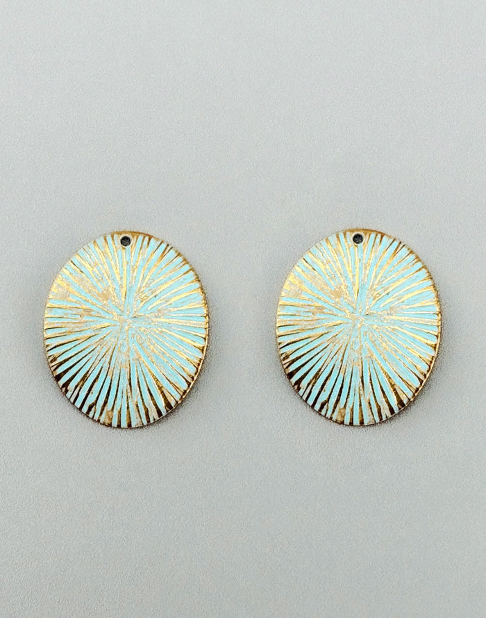 Light blue oval earrings with gold accents