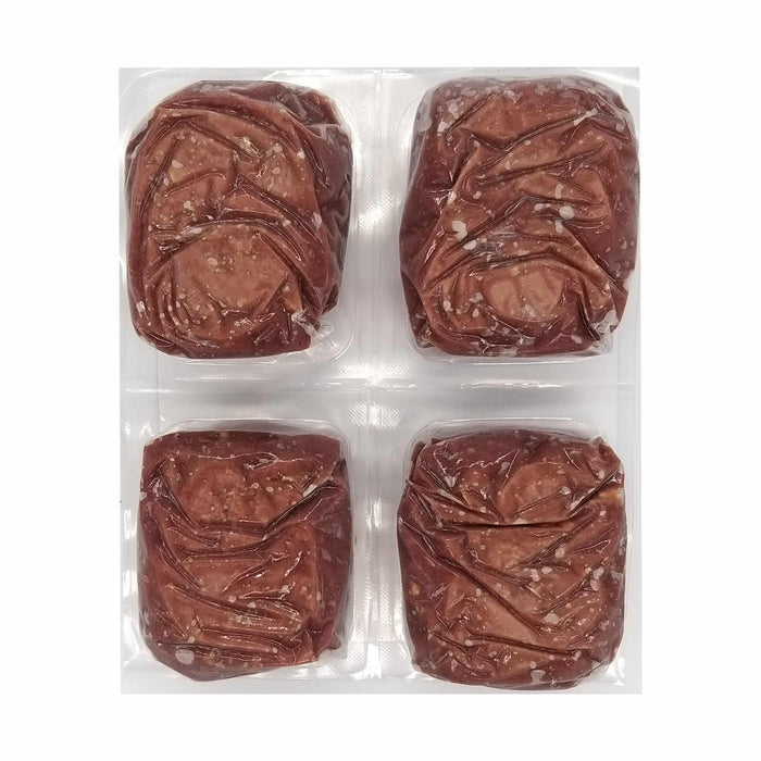 Butcher Blend Beef & Salmon for Cats: Four vacuum-sealed patties with visible meat and fat, portioned for a raw feline diet.