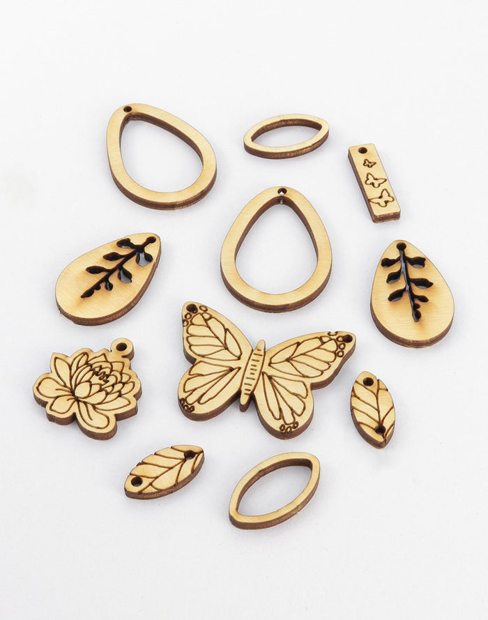 Laser-cut wooden jewelry charms (butterfly, leaves, ovals)