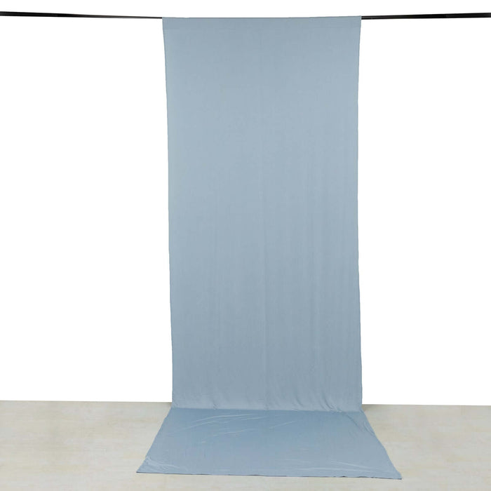 Blue fabric backdrop for photography, smooth texture and drape.