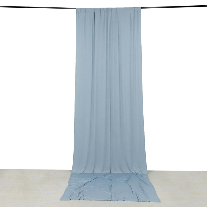Soft blue fabric drape on a plain backdrop