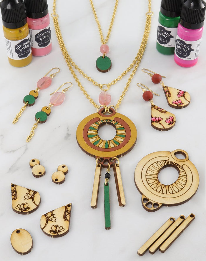 Jewelry pieces with patina and paint bottles