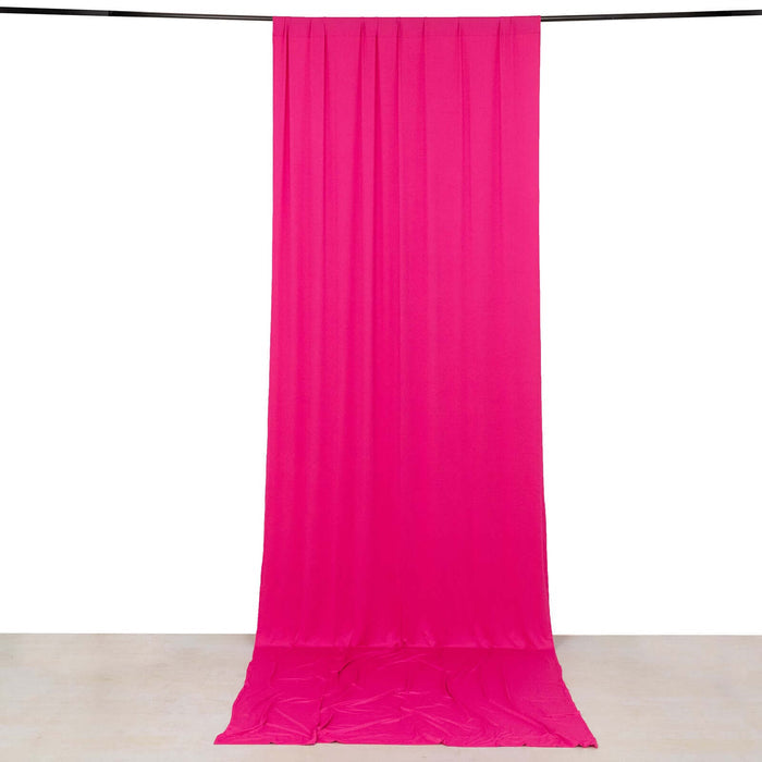 Bright pink backdrop fabric hanging in studio isolation