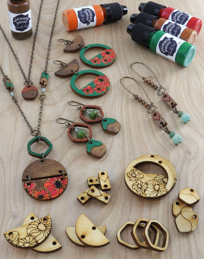 Wooden jewelry with poppy designs and patina paint