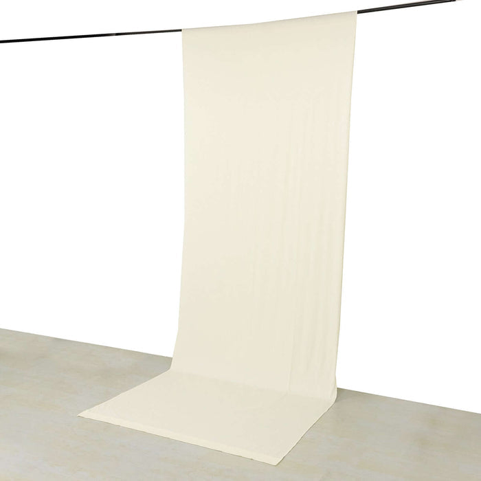 Beige fabric backdrop on a grey surface for photography and staging.