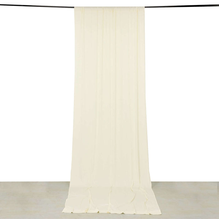 Cream-colored fabric backdrop hanging smoothly
