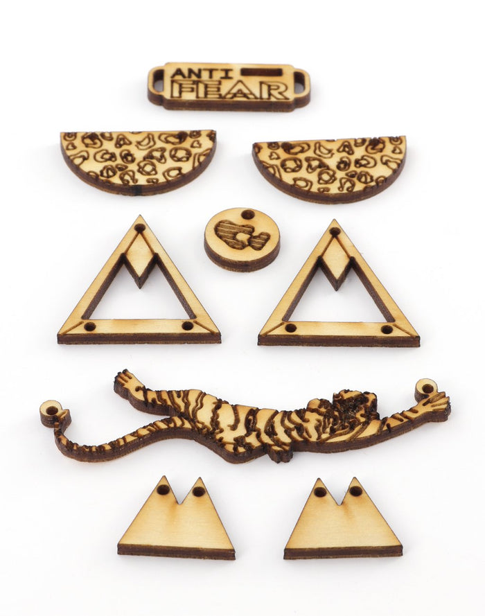 Laser-cut wooden tiger and Anti-Fear pieces