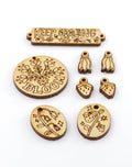 Wooden charms with Keep Growing and floral designs.