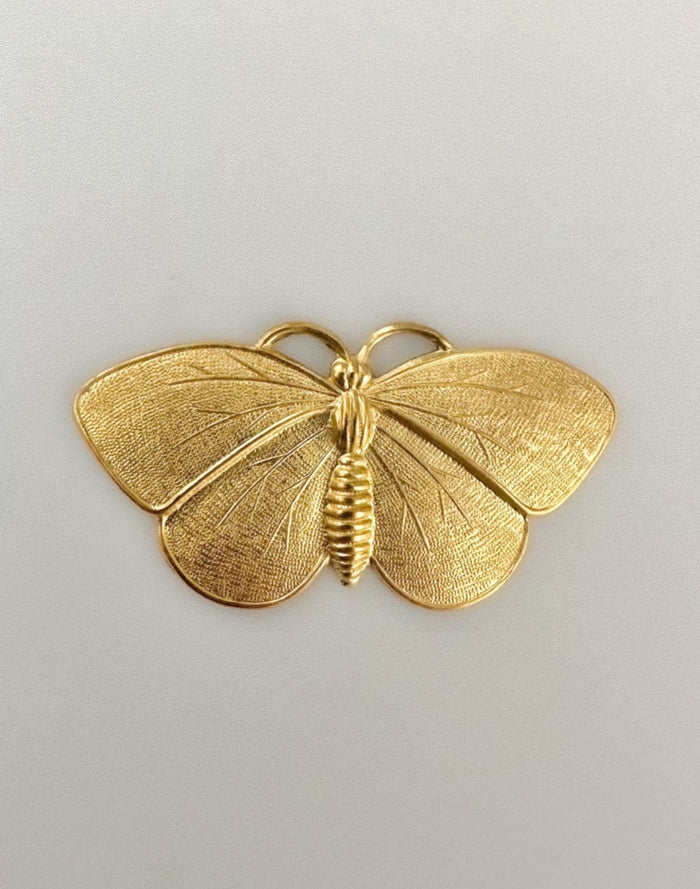 Gold butterfly brooch