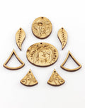 Wooden laser-cut jewelry pieces with floral and face designs
