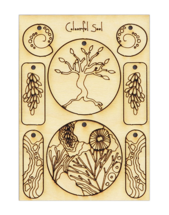 Laser-cut wooden Colorful Soul art with tree, sun, and shell designs.
