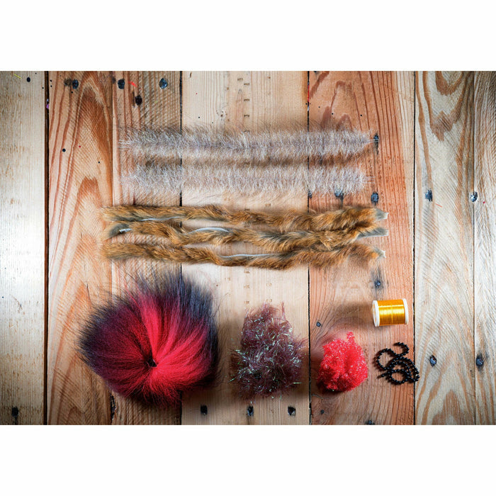 Contents of Megalolipop HD DIY Fly Tying Kit including arctic fox hair, marabou, and gold thread