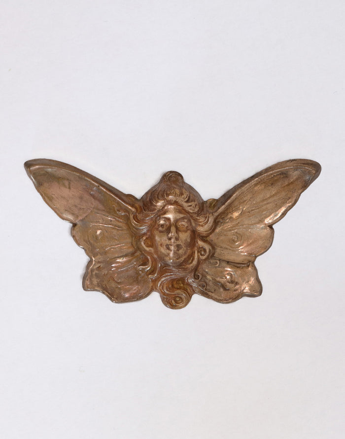 Antique metal fairy with wings