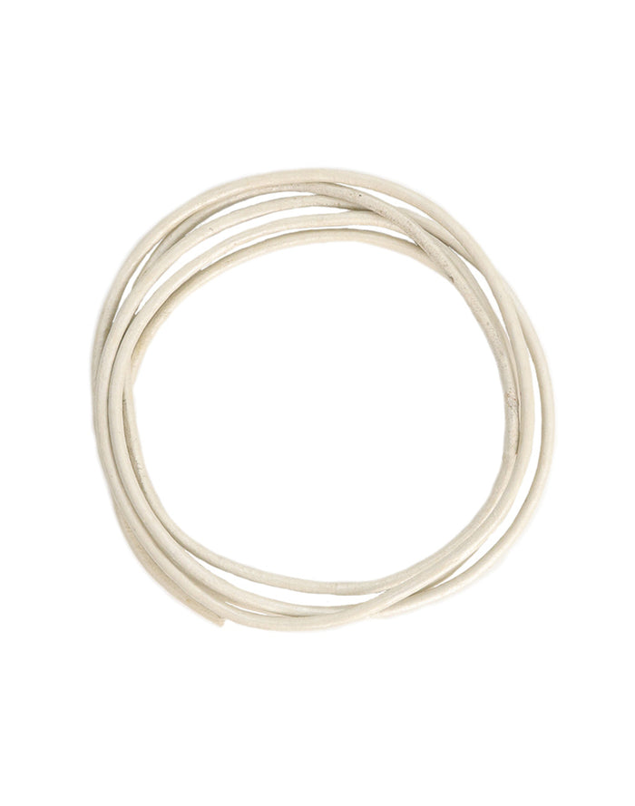 White coiled wire on white background.