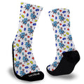 Blue puzzle piece holding lacrosse stick surrounded by smaller puzzle pieces on a white sock