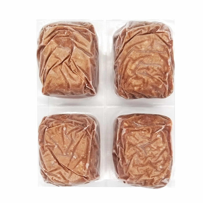 Red Dog Blue Kat Turkey for Dogs: four vacuum-sealed, brick-shaped portions of raw turkey blend for dogs, featuring meat, organs, and bone, ideal for freezer storage.
