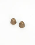 Two decorative bronze cone beads