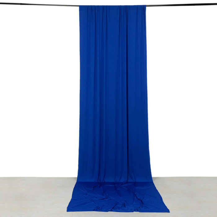 Blue fabric drape on a plain backdrop, creating an elegant flow.