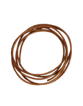 Burnt orange cord coiled on white background