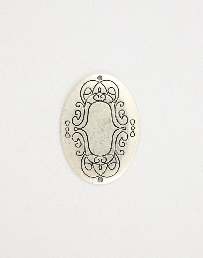 PT139-070 Oval metal embellishment with decorative scrollwork
