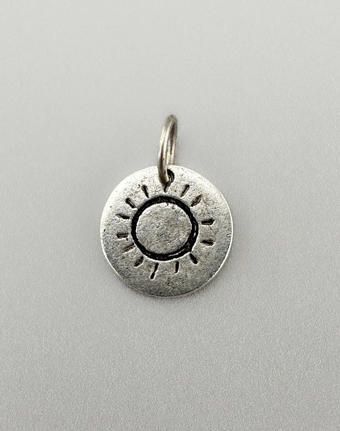 Sun charm pendant