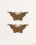Two bronze butterfly charms for jewelry making.
