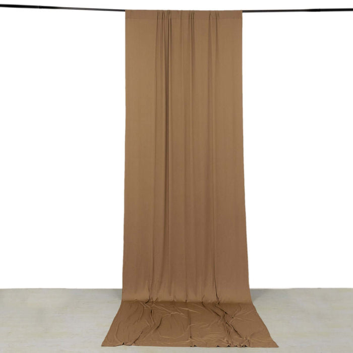 Brown fabric drape on a plain white backdrop