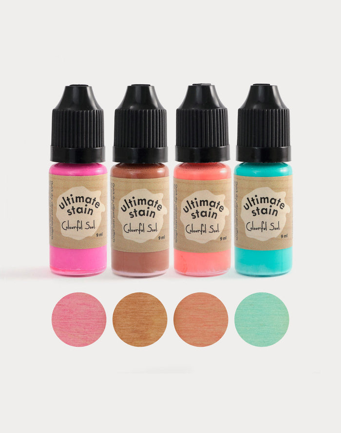 Colorful liquid stain bottles with color samples.
