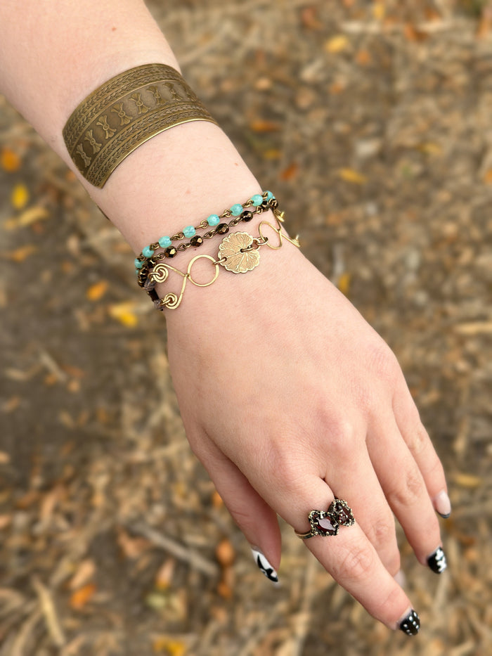 Woman's hand with bracelets and ring, image 938935FF-A262